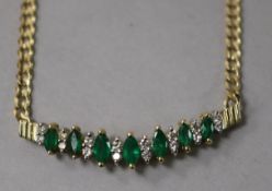 A 14ct gold, diamond and emerald set chevron shaped pendant, on a 14ct gold curb link chain, approx.