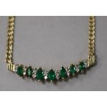 A 14ct gold, diamond and emerald set chevron shaped pendant, on a 14ct gold curb link chain, approx.