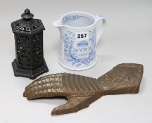 A Queen Victoria Golden Jubilee commemorative mug, a cast iron stove shaped money bank and an iron