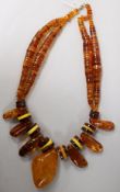 A large amber necklace, with assorted shaped beads, gross 221 grams.