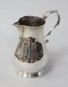 A George II style silver baluster cream jug by Goldsmiths & Silversmiths Co Ltd, London, 1917.