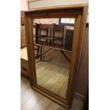 A pine wall mirror, H.153cm