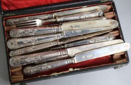 A set of twelve late Victorian silver dessert knives and ten matching forks