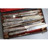 A set of twelve late Victorian silver dessert knives and ten matching forks