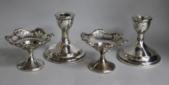 A pair of George V silver dwarf candlesticks, Birmingham 1936 and a pair of pedestal bon bon dishes,