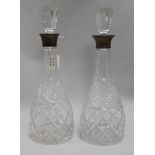 A pair of silver collared decanters