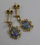 A pair of gold and opal pendant earrings