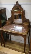 A French carved oak and rouge marble topped dressing table and matching bedside cupboards Dressing