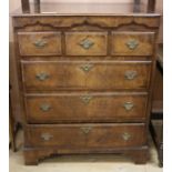 A mid 18th century North Country inlaid mahogany chest, of three short and three long drawers, W.