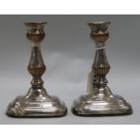 A pair of plated candlesticks