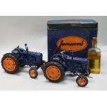 A live steam traction engine and two Chad Valley clockwork models of tractors