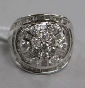 A diamond and 9ct white gold cluster ring