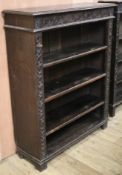 An Edwardian carved oak open bookcase, W.92cm