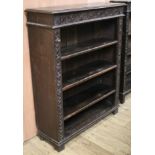 An Edwardian carved oak open bookcase, W.92cm