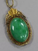 A Chinese gold framed jade pendant, in a Tessier box