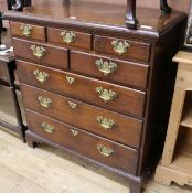 An 18th century style oak chest, of five short and three long drawers, W.90cm