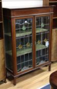 An Edwardian lead lit mahogany display cabinet, W.89cm