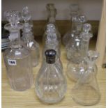 Eleven various cut glass decanters