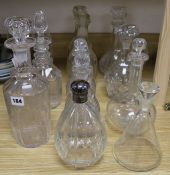 Eleven various cut glass decanters