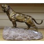 A bronze tiger on stone base, signed Heiteau