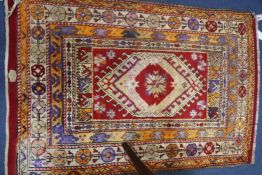 A small Turkish cream ground rug, 132 x 89cm