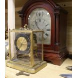 A German mahogany mantel clock and a brass chiming clock