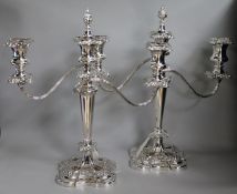 A pair of silver-plated two-branch three-light candelabra