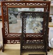 A Chinese pierced hardwood table screen with embroidered silk panel and a similar later screen