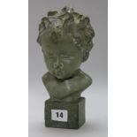 A terracotta bronzed bust of a child