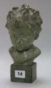 A terracotta bronzed bust of a child