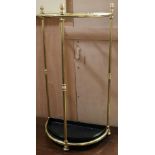 A brass umbrella stand