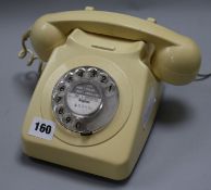 A cream bakelite telephone