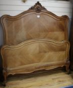 An early 20th century French walnut double bedstead, W.148cm