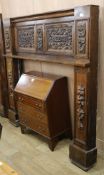 An early 20th century carved oak fire surround, from a house in Brunswick square Brighton W.188cm