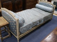 A French Louis XVI style cream painted day bed, L.200cm W.92cm