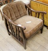 A 1930's stained beech armchair