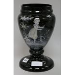 A black glass Mary Gregory style vase
