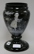 A black glass Mary Gregory style vase