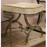 An X frame brass dressing stool