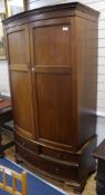 An Edwardian mahogany bowfront wardrobe