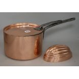 A copper saucepan and a jelly mould