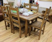 An oak refectory dining table and six chairs,