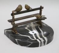 A Vide de Poche Art Deco bronze birds on a bench, on a marble base