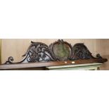 A Victorian carved and painted oak pediment, with central crest, removed from a Masonic Hall, now