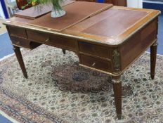 An early 20th century French Louis XVI style mahogany bureau plat, W.145cm