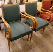 A pair of stylish 1940's beechwood elbow chairs