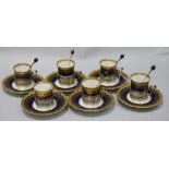 An Aynsley gilt and blue coffee set with silver holders and spoons