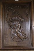 A 19th century French oak panel carved 'St Francis of Assiss, ex Chateau Champfleur'