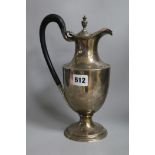 A late Victorian silver hot water pot, London 1900, gross 16ozs.