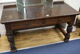 A pair of carved oak side tables, W.137cm